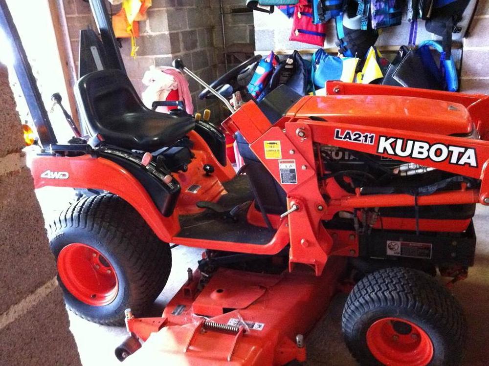 orange 2003 kubota bx2200 lawn mower with a mowing deck that was stolen